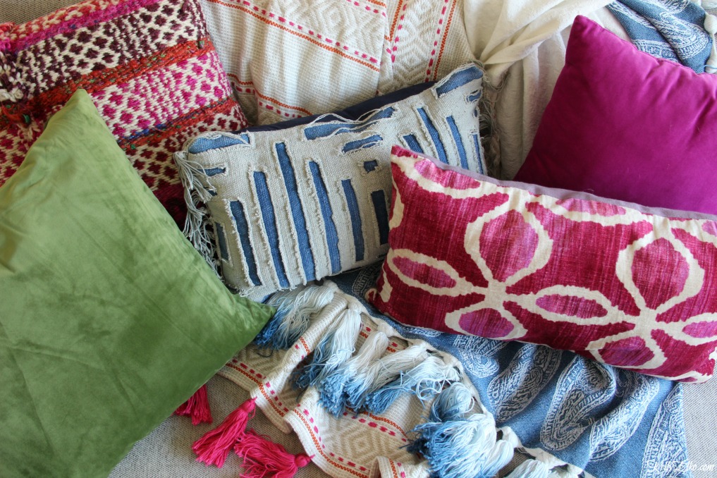 Eclectic mix of pillows and throws in blues, pinks and greens kellyelko.com 