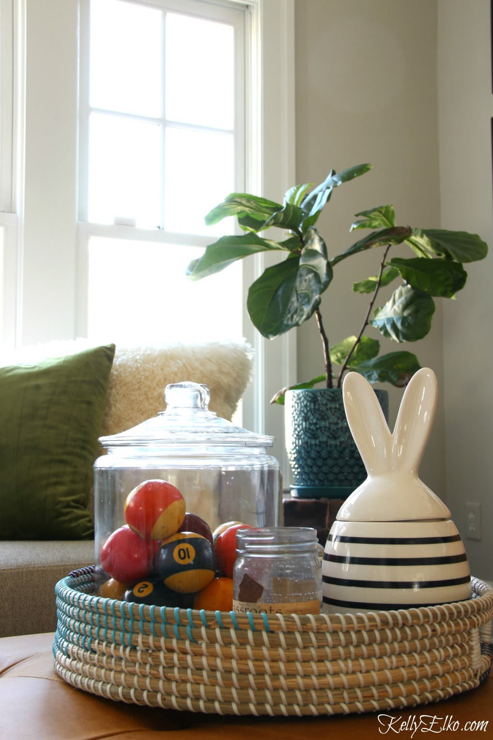 Love this spring family room and the cute woven basket filled with vintage pool balls and a modern bunny jar kellyelko.com #springdecor #homedecor #vintagedecor #bunny