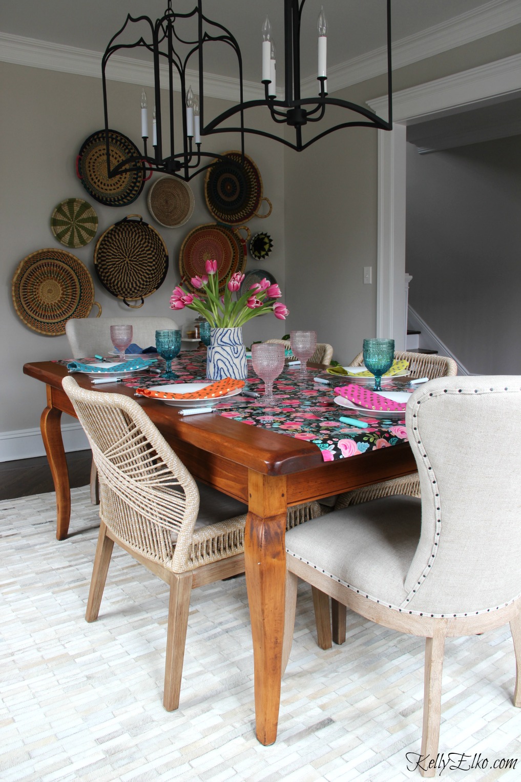 Spring table - love the graphic floral table runner with blue and pink glasses, colorful napkins and beautiful cowhide rug and rope chairs kellyelko.com