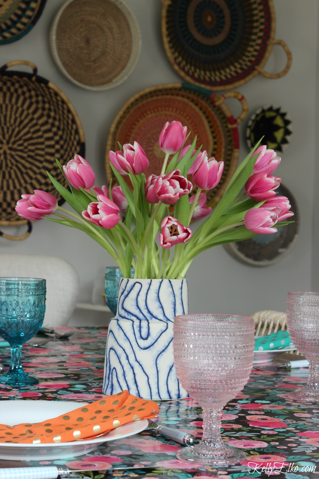 Spring table - love the blue and pink glasses and tulip centerpiece kellyelko.com