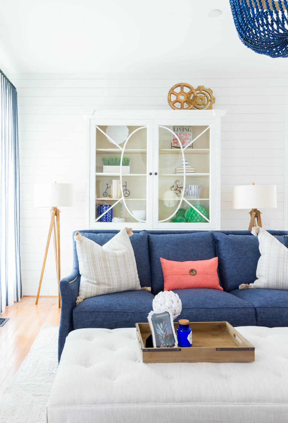 Eclectic Home Tour - love the white shiplap walls as a backdrop for blue sofas and chandelier #shiplap #neutraldecor #coastaldecor