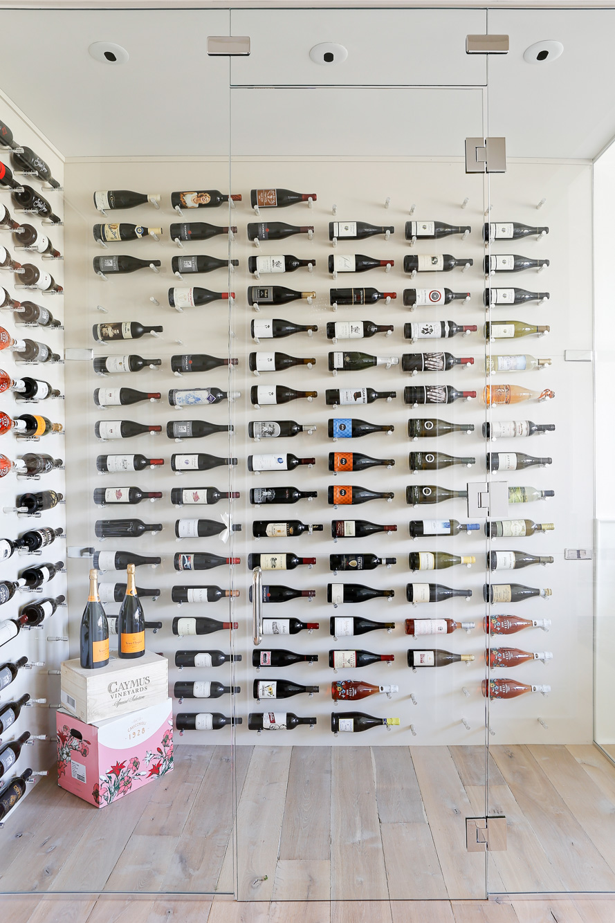 Eclectic Home Tour - love this over the top modern wine room with glass walls #wine #winestorage #wineroom