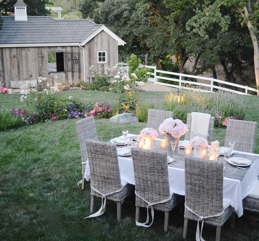 Charming horse barn with beautiful landscaping and flowers 