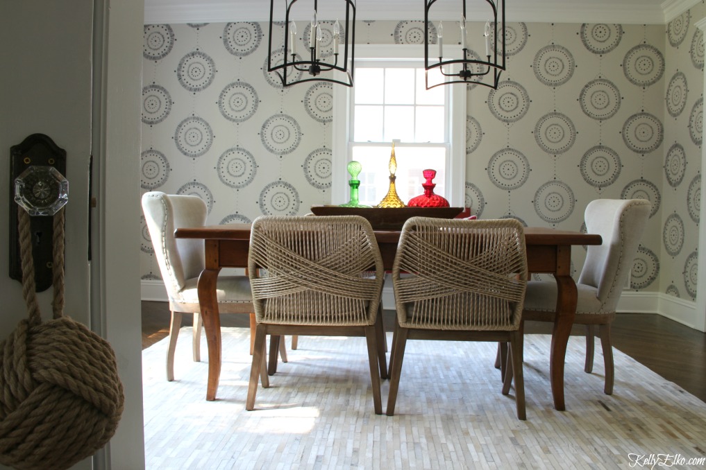 Forget wallpaper! This hand painted mural is like faux wallpaper minus the expense and I love the rope chairs and pair of giant lanterns kellyelko.com #wallpaper #mural #diningroom #wallart #handpainted 