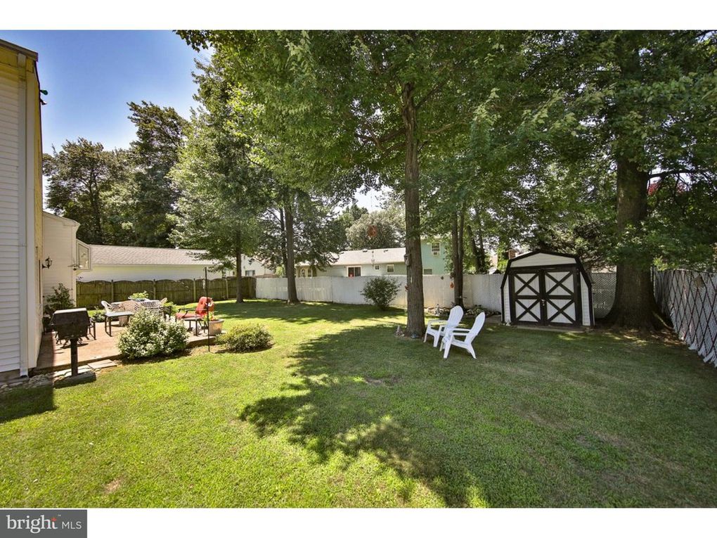 Big backyard with black and white shed kellyelko.com #backyard #shed 