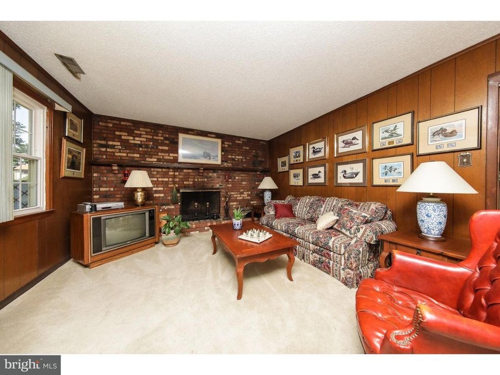 1970 split level home tour with brick fireplace wall and wood paneling kellyelko.com #woodpaneling #hometour #vintagehome #brickmantel #brickfireplace #vintagefamilyroom