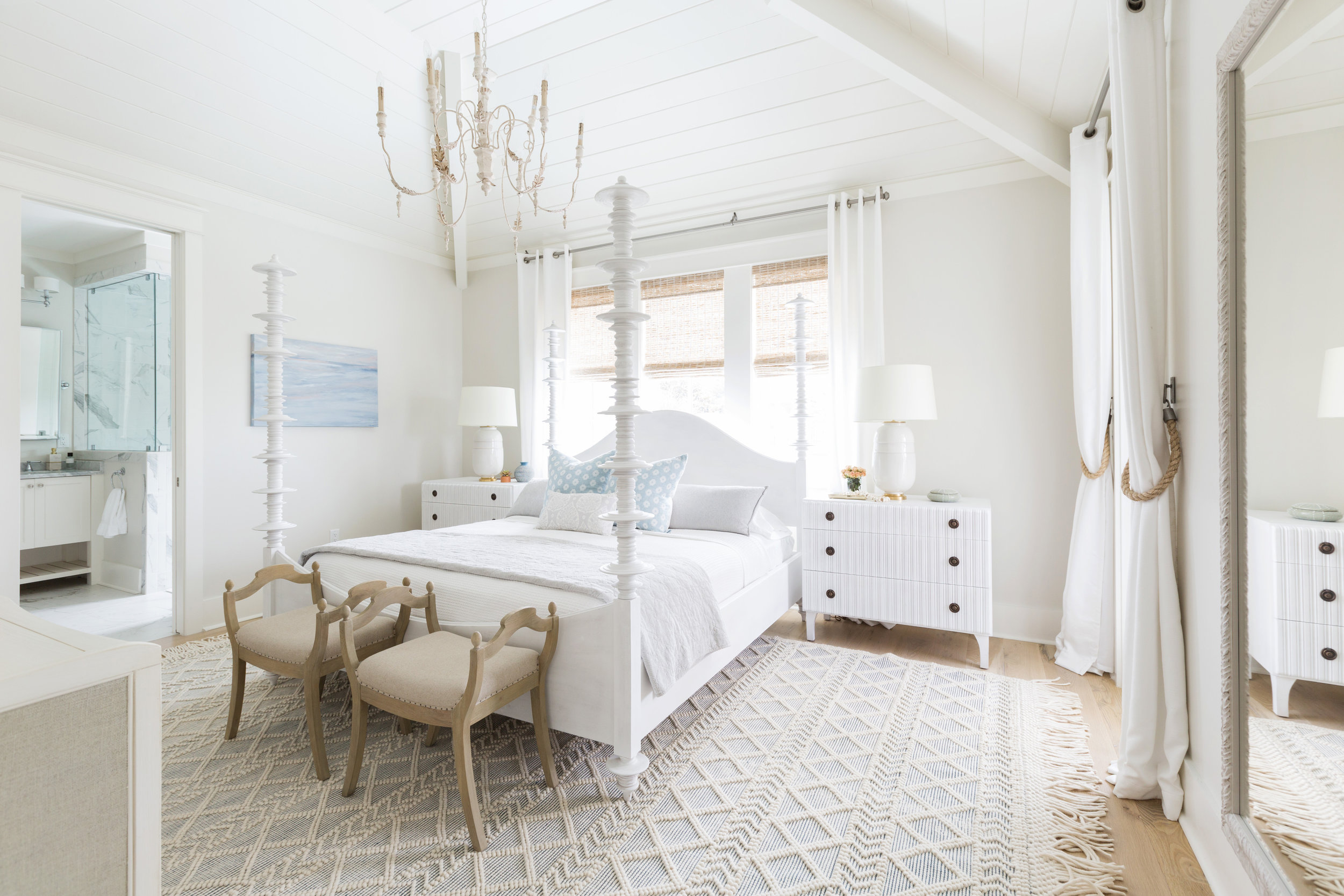 Love this neutral master bedroom with four poster bed, ornate chandelier and textured rug kellyelko.com #bedrooms #bedroomdecor #decorate 