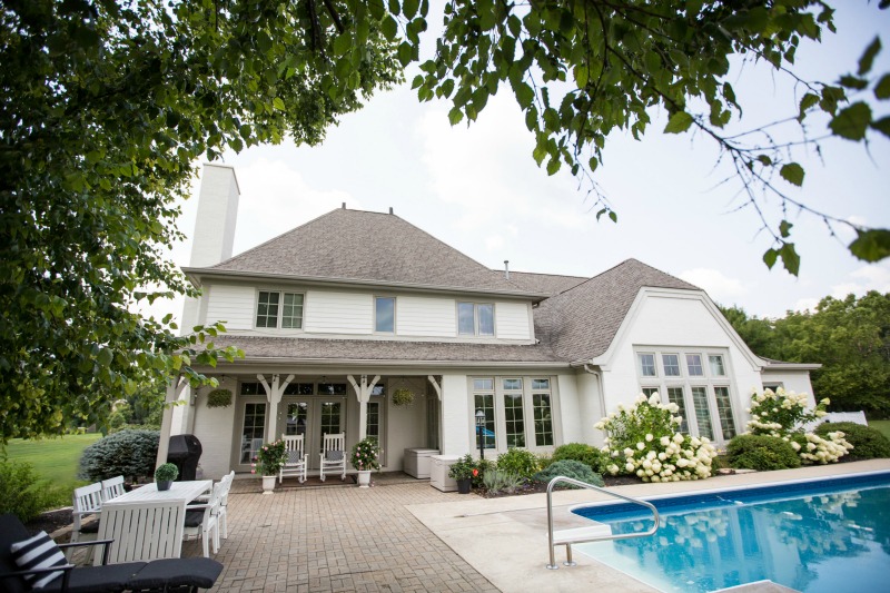 Beautiful backyard with in ground pool, hydrangeas and covered patio kellyelko.com #ingroundpool #backyard #patio #hydrangeas