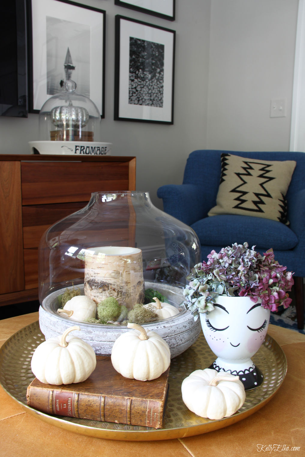 Simple Fall Touches - love this huge brass tray with terrarium of moss and pumpkins and the head vase with hydrangeas kellyelko.com #fall #falldecor #falldecorating #interiordecor #pumpkins #hydrangeas #eclecticstyle #autumndecor