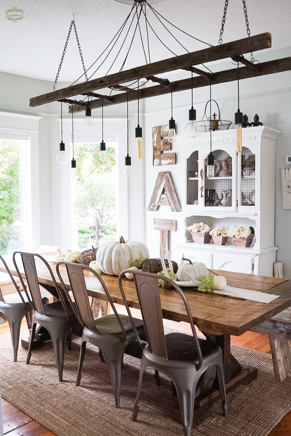 Farmhouse dining room with DIY chandelier using an old ladder kellyelko.com #diningroom #falldecor #chandelier #diylighting #farmhousedecor 