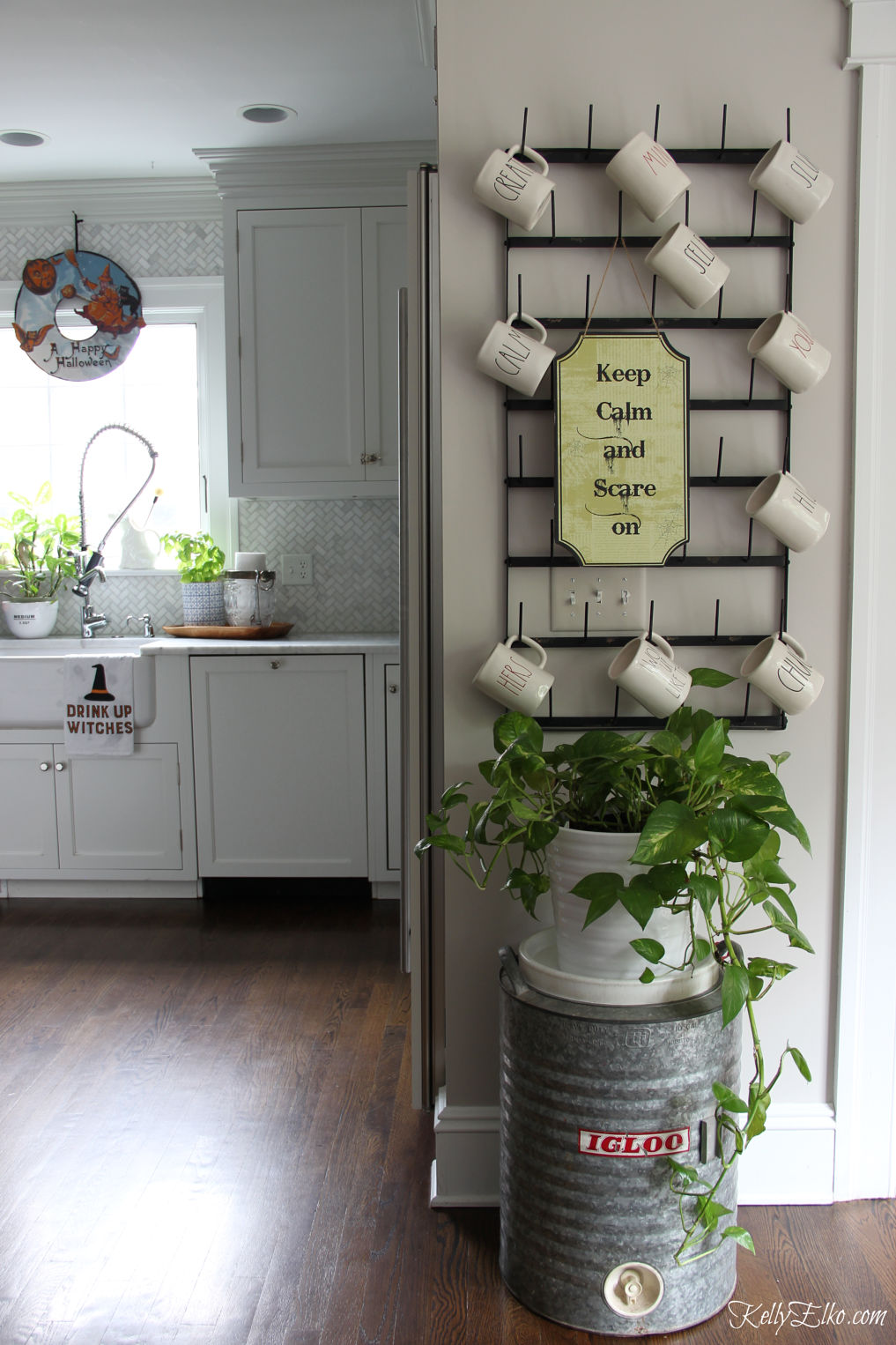 Halloween home tour - love the huge bottle drying rack and Halloween signs kellyelko.com #halloween #halloweendecor #halloweendecorations #farmhousestyle