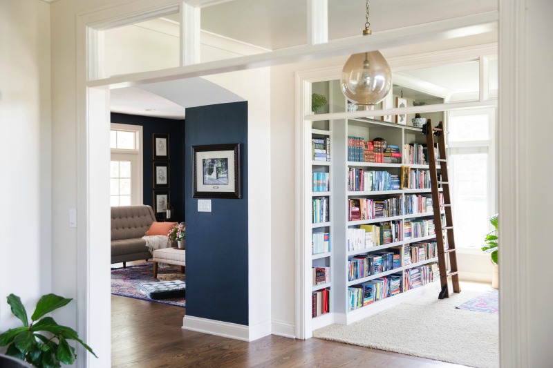 Colorful home tour - love the built in bookcase with rolling library ladder kellyelko.com #bookcase #library #diyideas #homeoffice #bookshelves