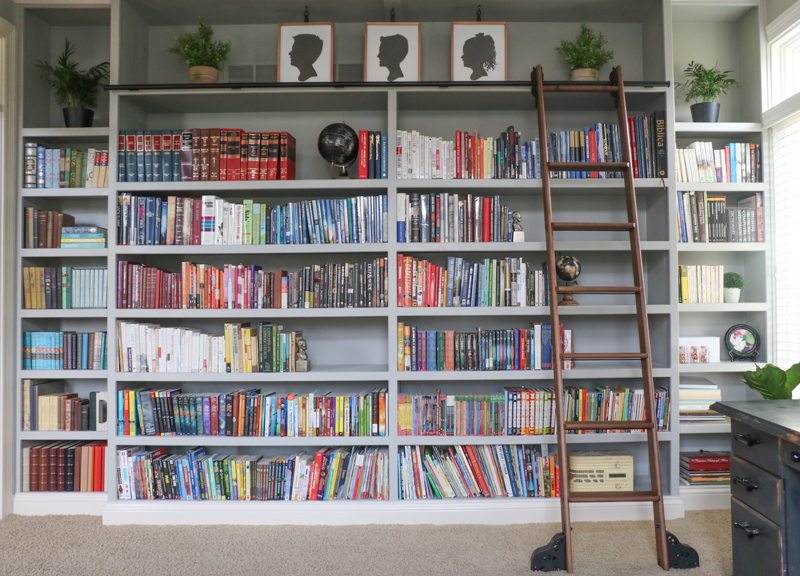 Colorful home tour - love the built in bookcase with rolling library ladder kellyelko.com #bookcase #library #diyideas #homeoffice #bookshelves