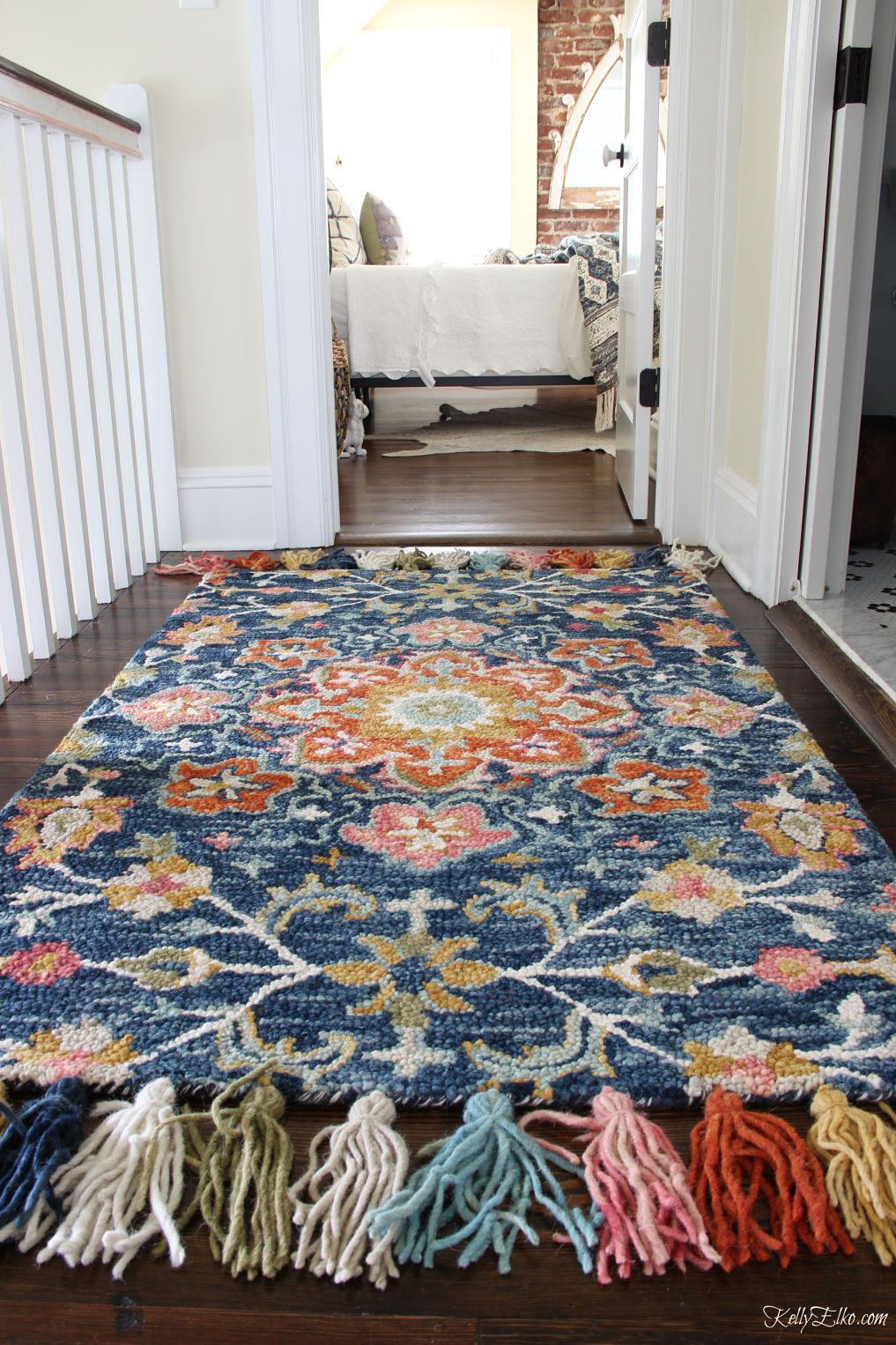 Guest Bedroom Decor - love this colorful rug with huge tassels kellyelko.com #bedroom #bedroomdecor #bedroomfurniture #bedroomdecorating #guestbedroom #rugs #loloi #bohodecor