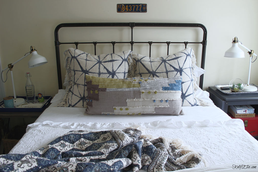 Guest Bedroom Decor - love the iron bed and white bedding with lots of fun, colorful pillows kellyelko.com #bedroom #bedroomdecor #bedroomfurniture #bedroomdecorating #guestbedroom #bedding 