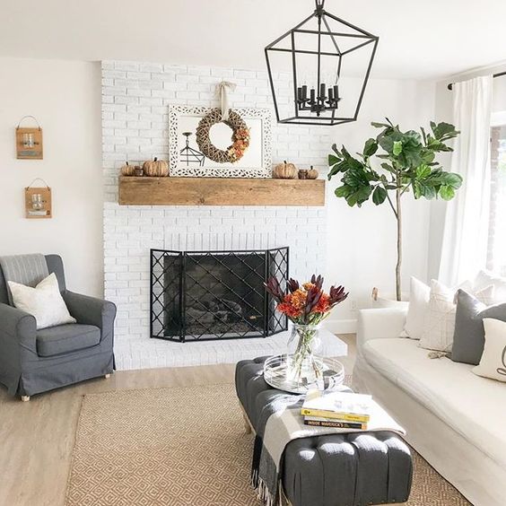 Eclectic Home Tour 1111 Light Lane - love the white painted brick fireplace in this charming cottage kellyelko.com #fireplace #mantel #brickfireplace #paintedbrick #familyroom #cottagestyle #farmhousestyle #neutraldecor 