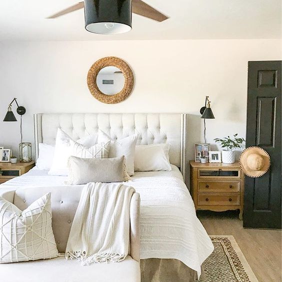 Eclectic Home Tour 1111 Light Lane - love this neutral farmhouse master bedroom with upholstered bed kellyelko.com #bedroom #masterbedroom #neutraldecor #whitebedroom #lighting #cottagestyle #farmhousestyle #farmhousedecor #cottagedecor