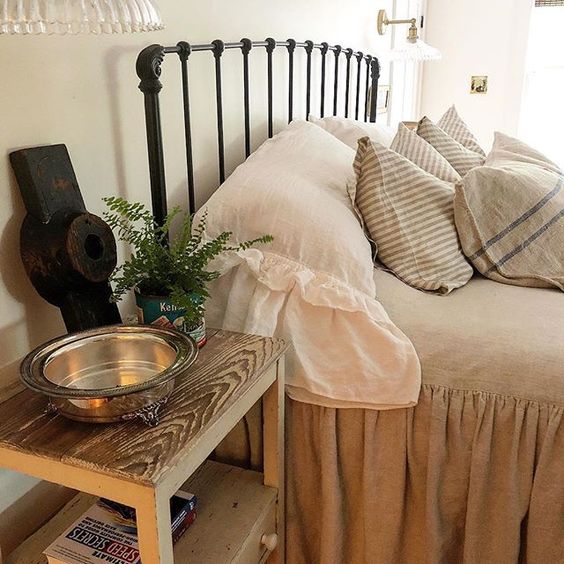 Eclectic Home Tour of The Cobbler Shop on Concord - love the iron bed and ruffled bedding kellyelko.com #farmhouse #farmhousedecor #interiordecor #interiordecorate #bedroom #bedroomdecor #cottagestyle #hometour #housetour 