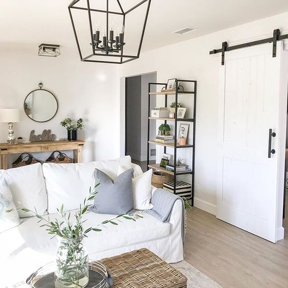 Eclectic Home Tour 1111 Light Lane - love this farmhouse style home and the rolling barn door kellyelko.com #farmhousestyle #cottagestyle #neutraldecor #familyroom #interiordecor #lighting 