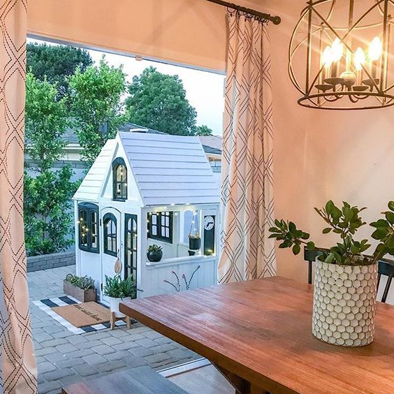 Eclectic Home Tour 1111 Light Lane - love this cute little playhouse outside this cottage kellyelko.com #playhouse #patio #farmhousedecor #cottagedecor 