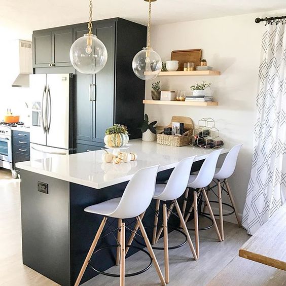 Eclectic Home Tour 1111 Light Lane - love this stunning kitchen with black cabinets and wrap around windows kellyelko.com #kitchen #kitchendecor #kitchendesign #kitchenrenovation #blackcabinets #farmhousestyle #cottagestyle