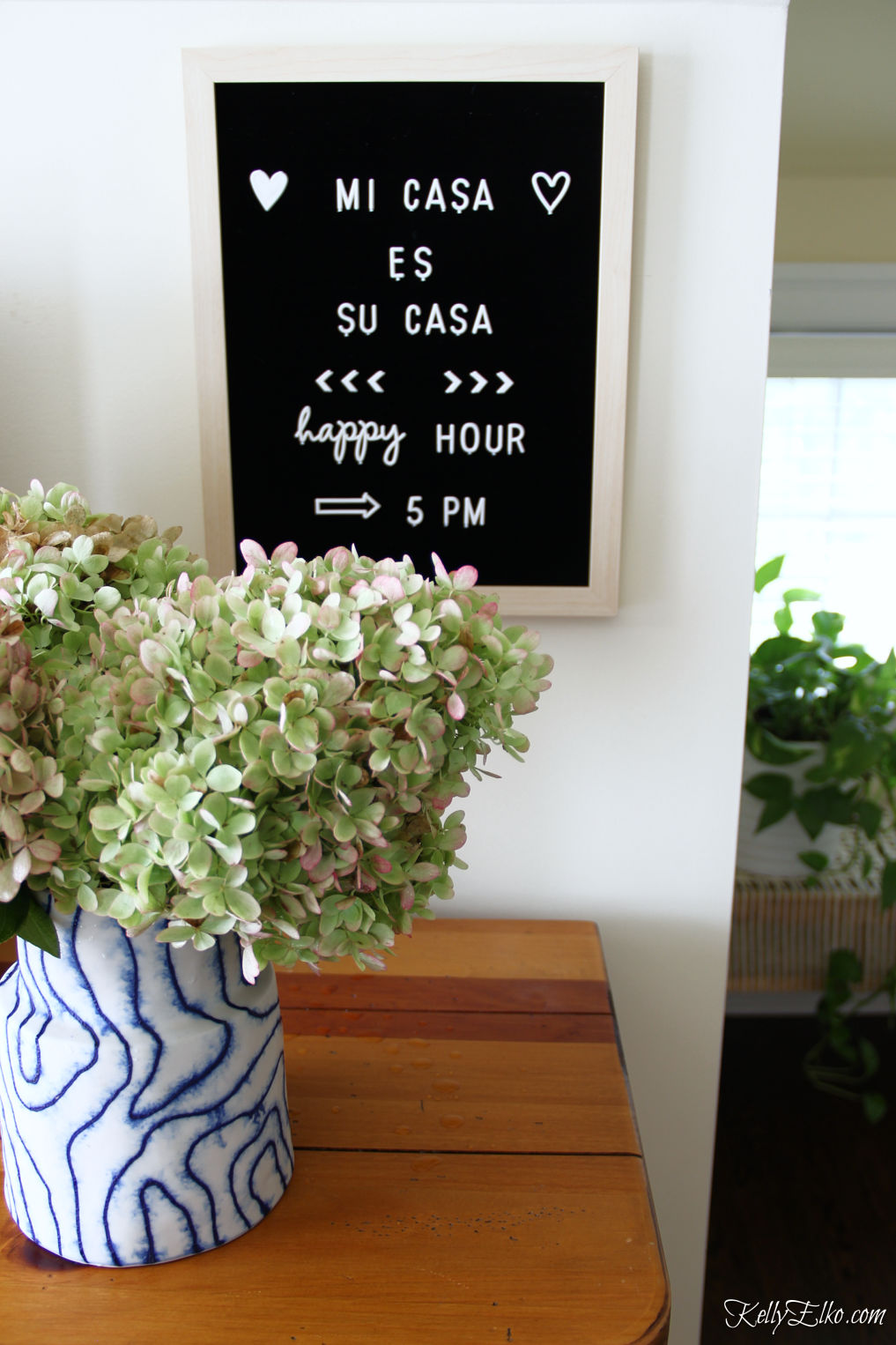 Little details in this guest bedroom include a letter board for adding fun notes kellyelko.com #letterboard #guestbedroom #bedroomdecor #hydrangeas