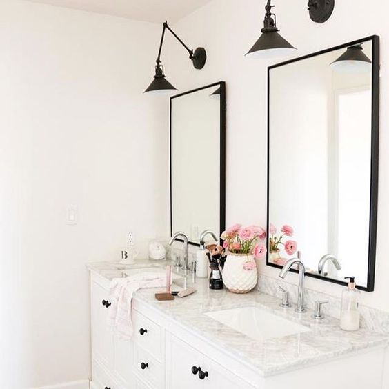 Eclectic Home Tour 1111 Light Lane - love this white bathroom with marble counter and black sconces kellyelko.com #bathroom #masterbathroom #doublevanity #sconces #lighting #industrialstyle #blackandwhite #interiordecor 