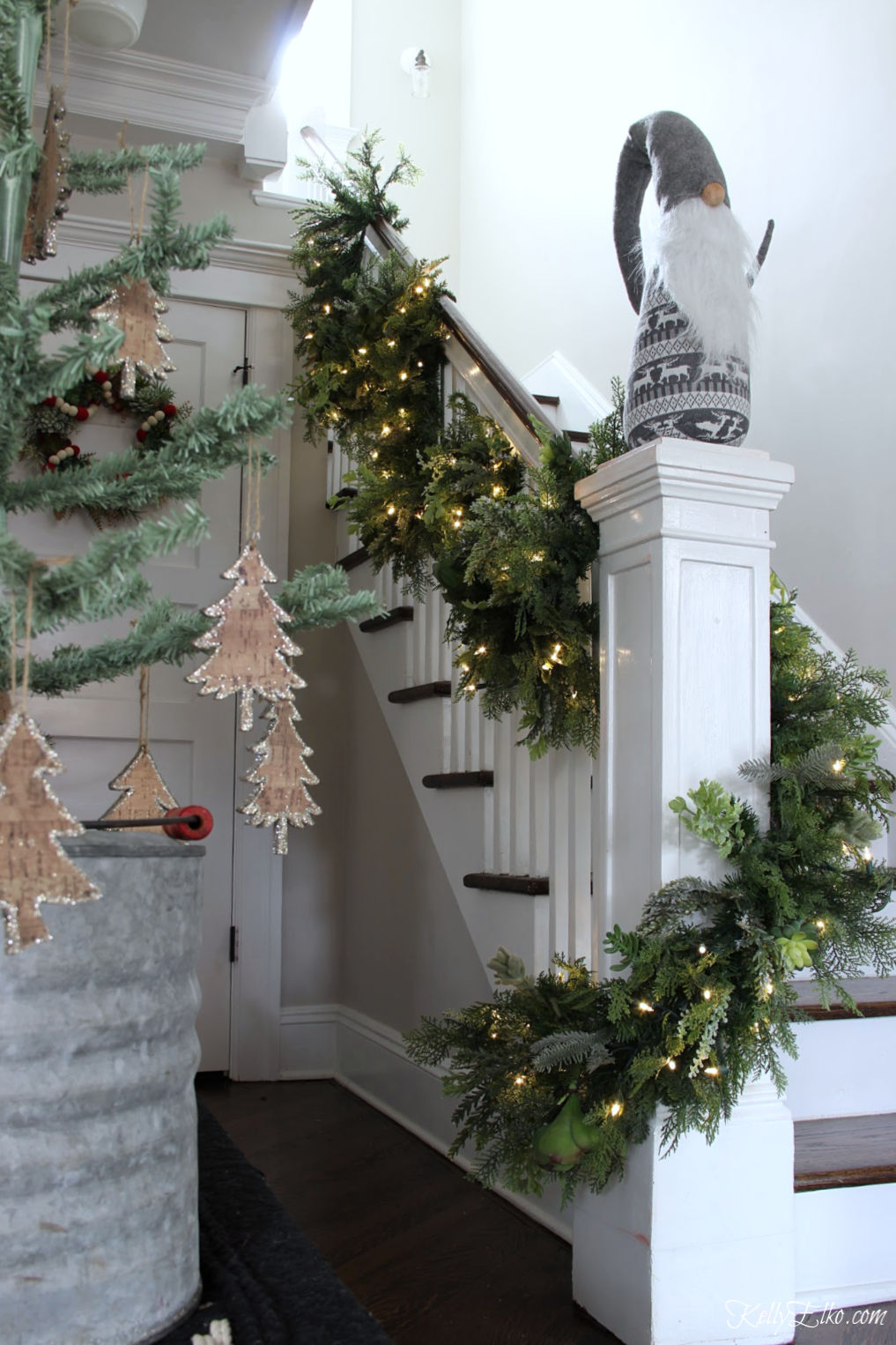 Tour this stunning Christmas home - love the lush succulent garland on the banister kellyelko.com #christmas #christmasgarland #christmasstairs #christmasbanister #gnone #christmasdecor #christmashometour