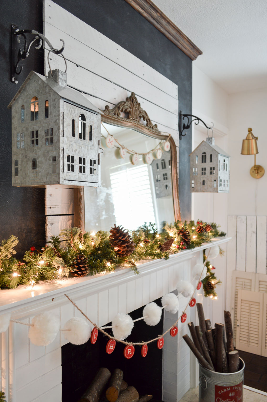 Beautiful Christmas mantel with house lanterns kellyelko.com #christmasdecor #christmasmantel #farmhousechristmas 