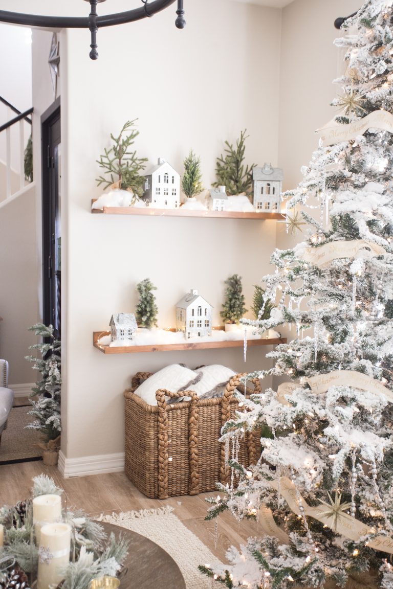 Love this winter village of galvanized little houses kellyelko.com #christmasdecor #neutralchristmas #farmhousechristmas #christmastree #flockedtree #christmasdecorations #neutralchristmas #whitechristmas #kellyelko