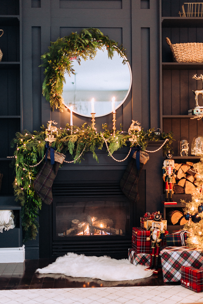 Love how she turned a mirror into a Christmas wreath on this stunning mantel