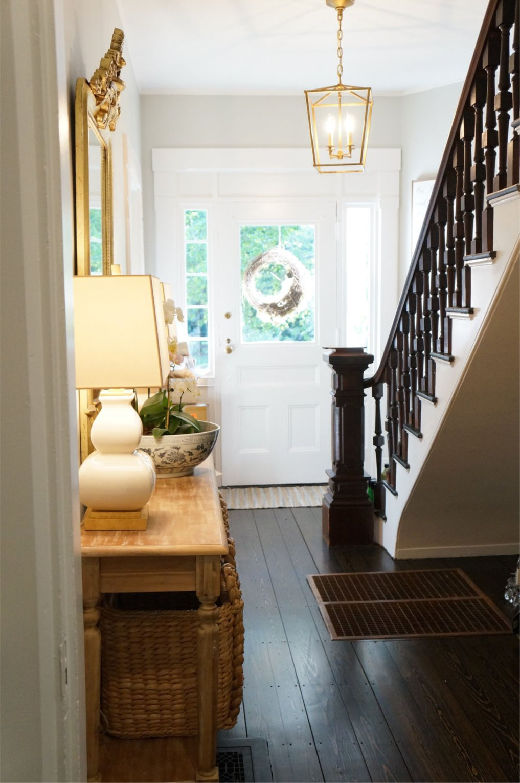 Eclectic Home Tour Finding Lovely - this beautiful old home has been updated but keeps it's charming details like the wood banister and original wood floors kellyelko.com #foyer #entry #oldhome #vintagestyle #vintagedecor #farmhousestyle #farmhouse #interiordecorate #interiordesign