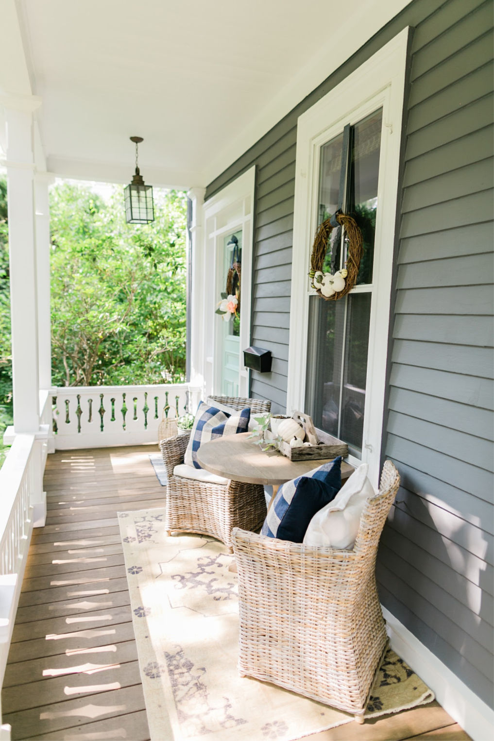 Charming front porch with beautiful cutout railing kellyelko.com #porch #frontporch #oldhome