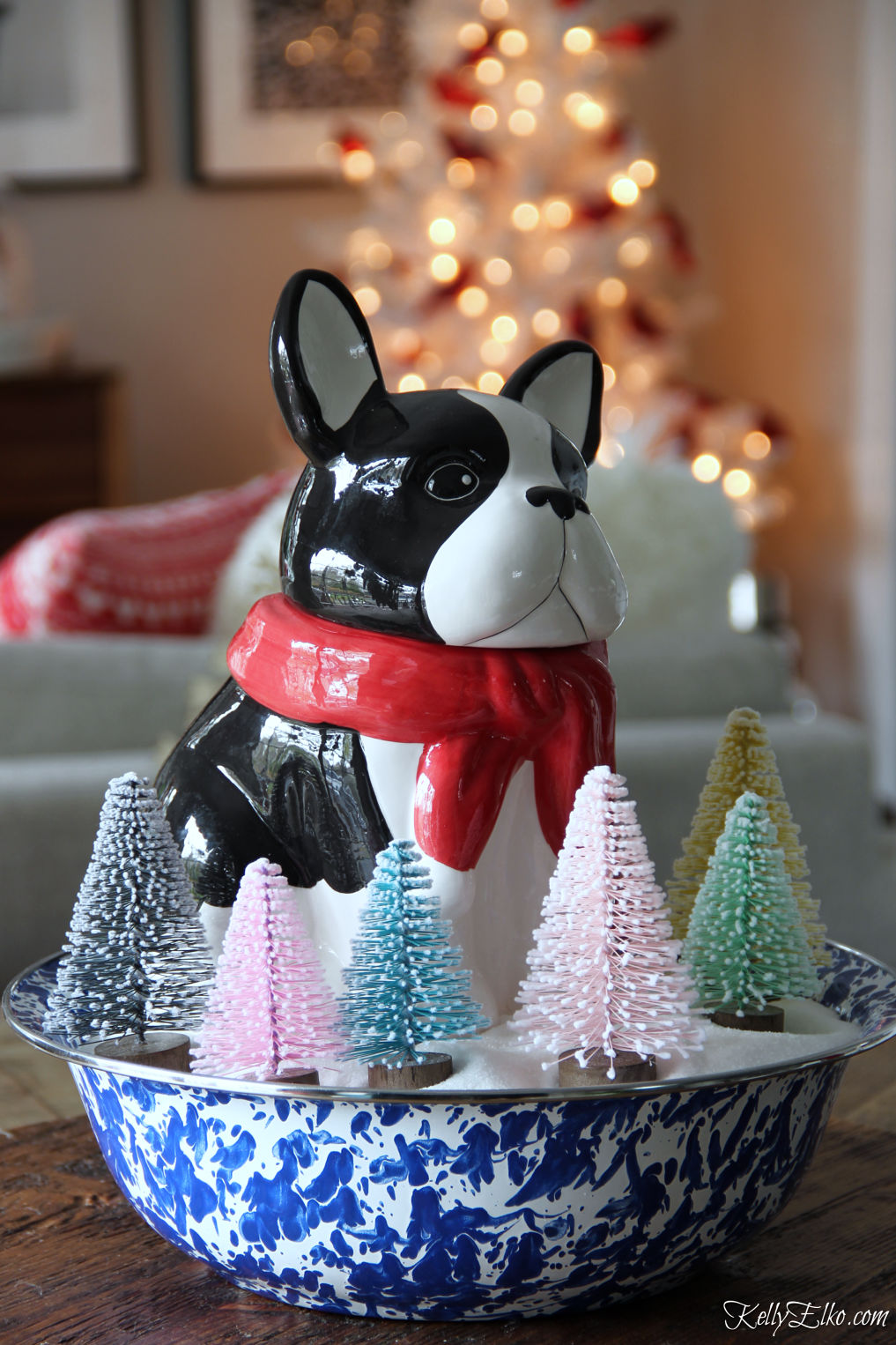 Love this little dog French Bulldog cookie jar surrounded by bottle brush trees for Christmas kellyelko.com #frenchbulldog #christmasdog #christmasdecor #christmascenterpiece #whimsicalchristmas #bottlebrushtrees #vintagechristmas 