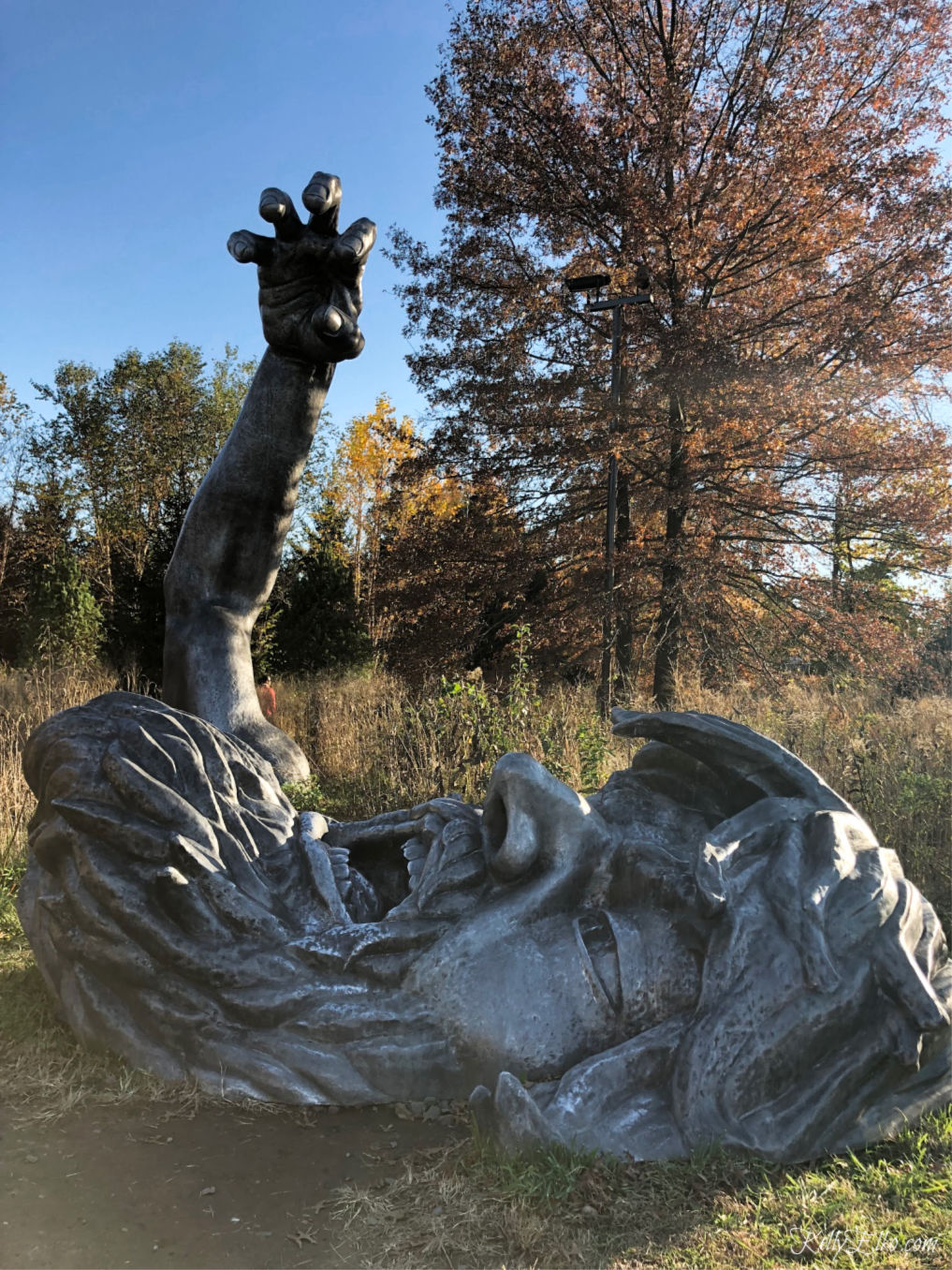 Grounds for Sculpture is a must see for art lovers - The Awakening is a 70 foot giant buried in the ground kellyelko.com #sculpture #art #artlovers #njtravel #travelblog #visitnj 