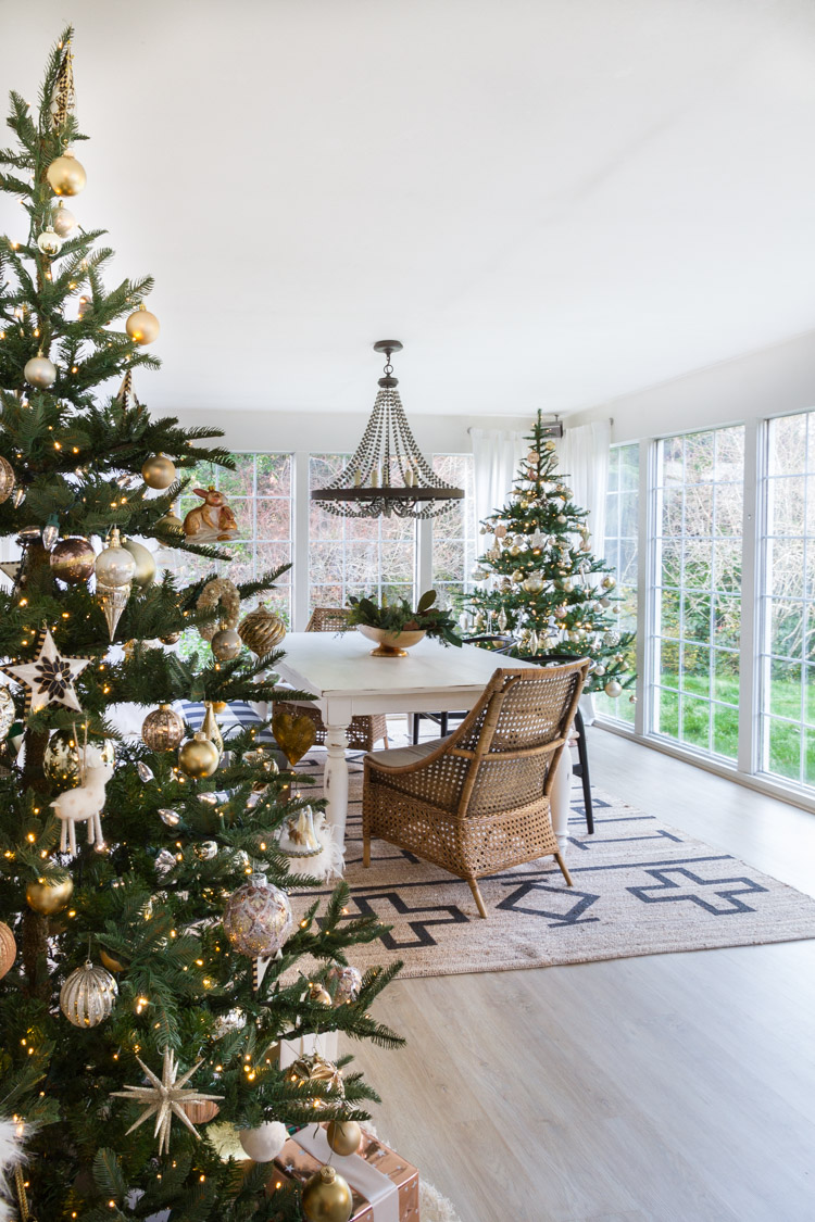 Love this dining room with two Christmas trees 