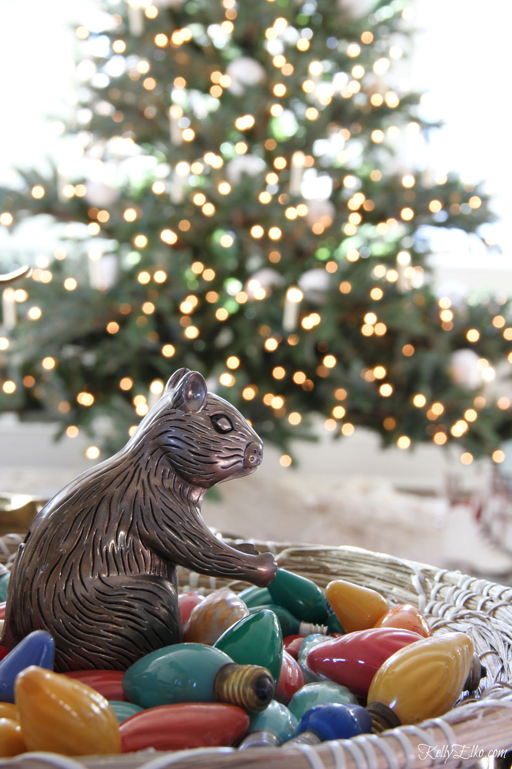 Love all the little details in this Christmas home including a vintage squirrel nutcracker in a bowl of old tree lights kellyelko.com #vintagechristmas #christmastree #christmaslights #christmasdecor #christmasvignette 