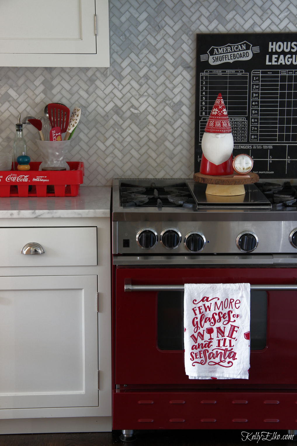 Love this red stove in this Christmas kitchen kellyelko.com #whitekitchen #redstove #christmaskitchen #farmhousechristmas #christmasdecor #gnome #vintagechristmas 