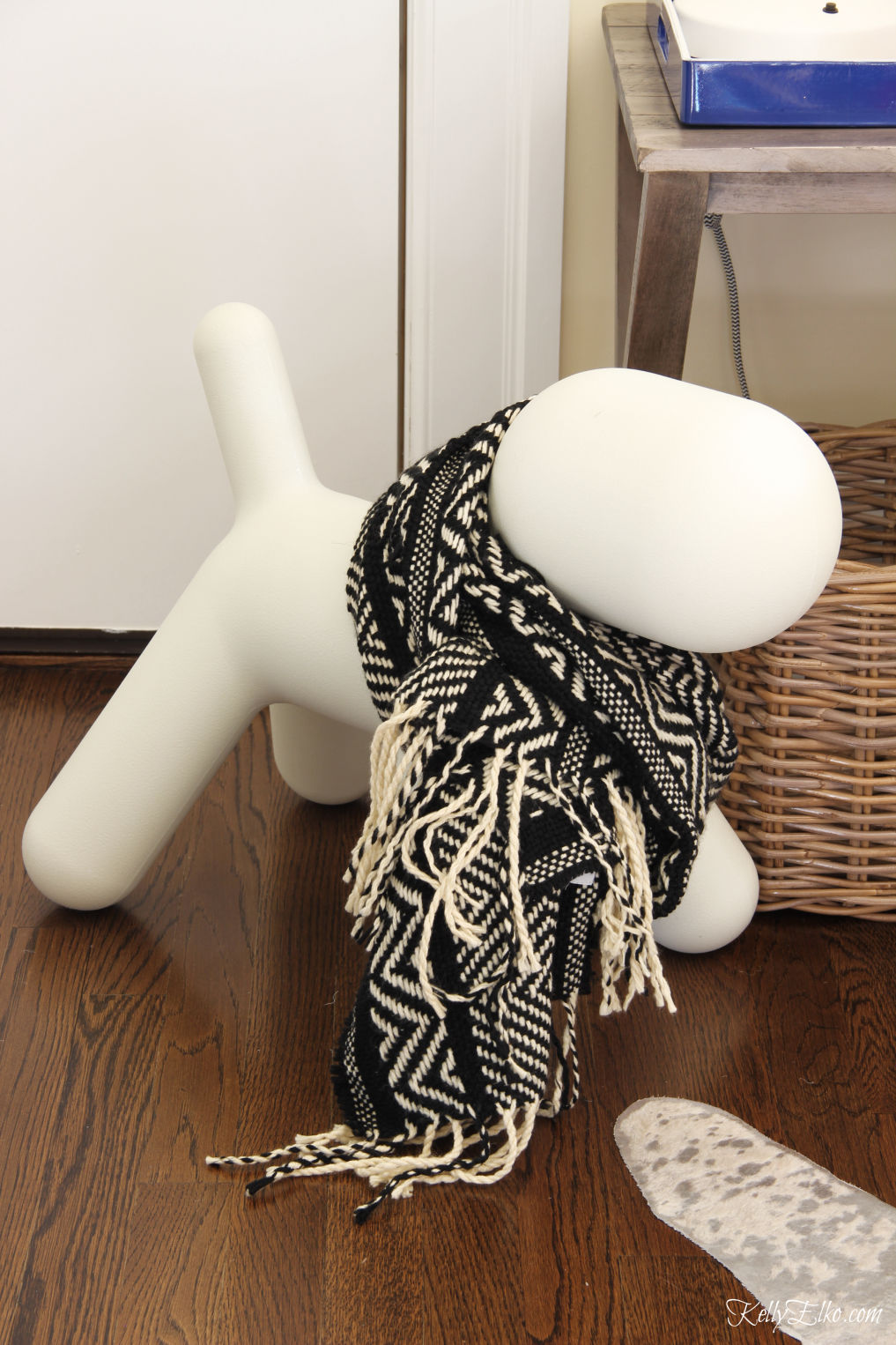 How cute is this dog sculpture wearing a cozy winter scarf kellyelko.com #christmas #christmasdecor #christmasdog