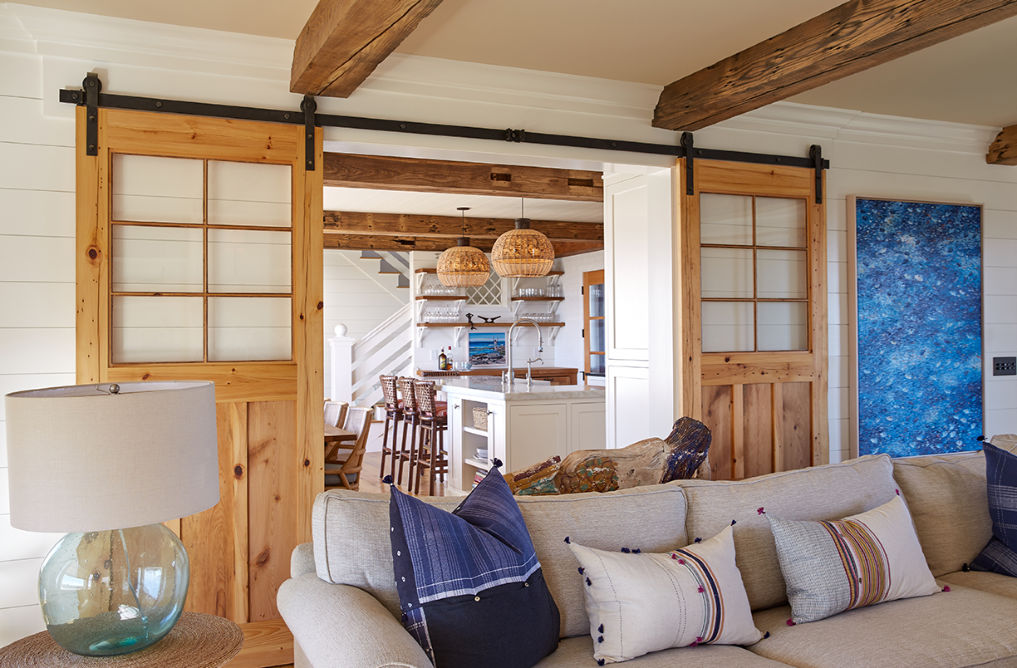 Beautiful farmhouse family room with shiplap walls and sliding barn doors kellyelko.com #farmhousestyle #farmhousedecor #barndoors #familyroom #familyroomdecor #familyroomfurniture #interiordecor #interiordesign 