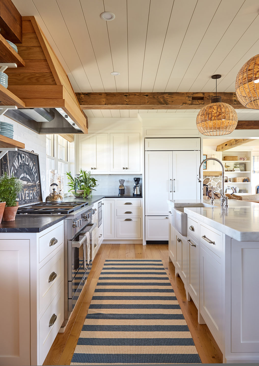 Love this farmhouse style kitchen with white cabinets and natural wood beams and shelves kellyelko.com #farmhousekitchen #kitchendecor #kitchenreno #whitekitchen #farmhousedecor #farmhousestyle #fixerupperstyle 