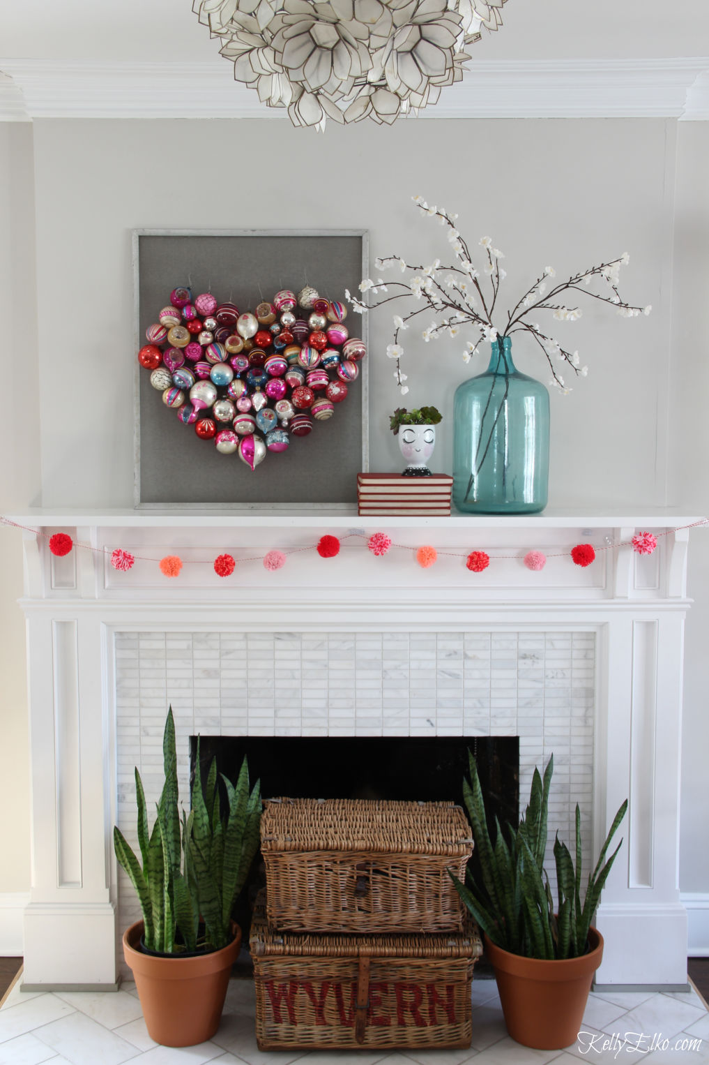 Beautiful spring mantel with a heart made out of vintage Christmas ornaments! / kellyelko.com