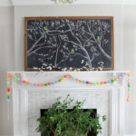 Spring Chalkboard Mantel kellyelko.com #spring #mantel #springdecor #chalkboard #chalkart #livingroomdecor #lighting #plants