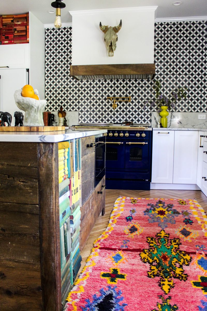 Boho kitchen - love the bold pattern tile backsplash, blue stove and reclaimed wood island kellyelko.com #boho #bohodecor #kitchen #whitekitchen #backsplash #vintagemodern 