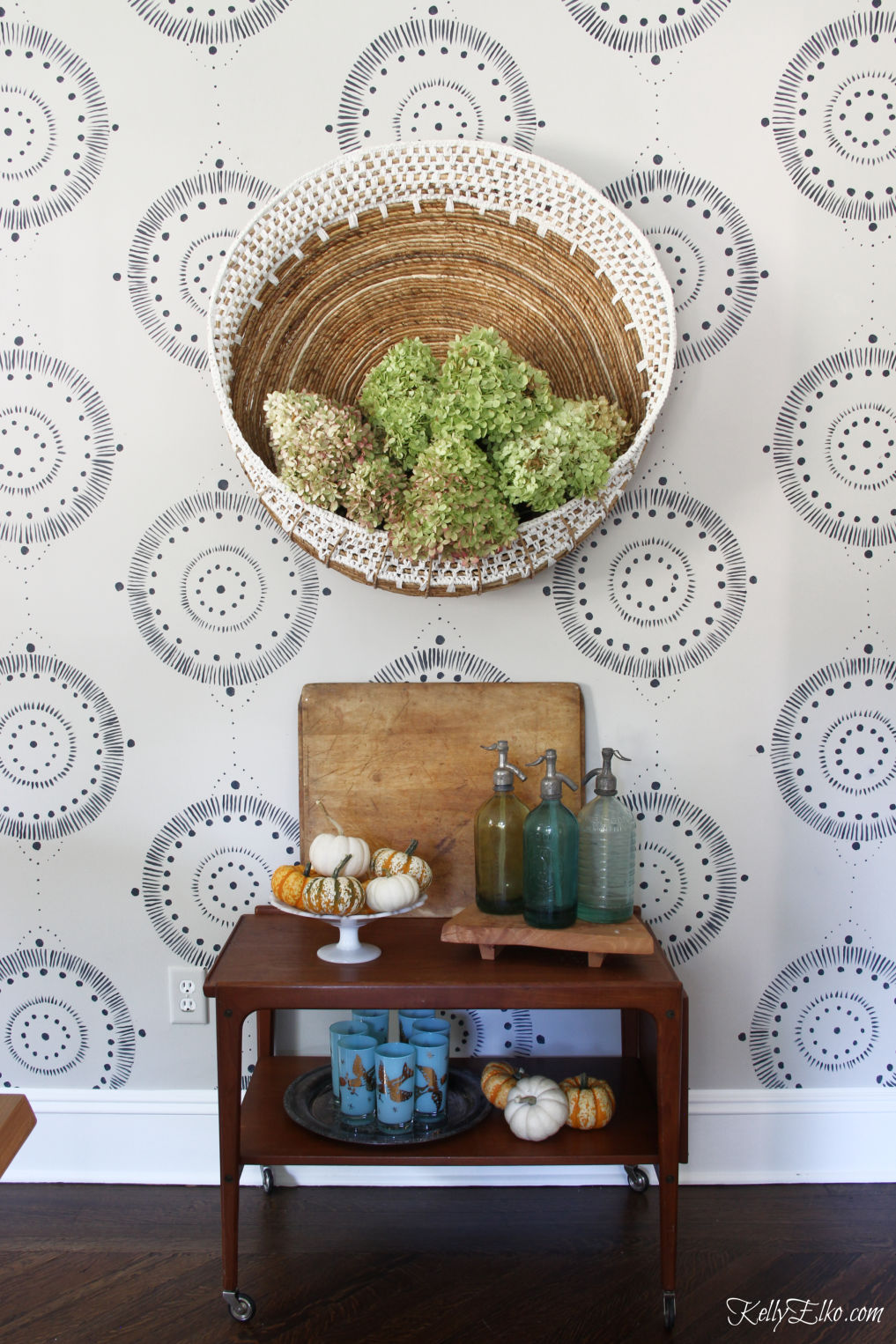 Bar Cart Styling - three different looks! Love the huge wall basket filled with hydrangeas for fall and the vintage finds kellyelko.com #barcart #bohodecor #eclecticdecor #homedecor #falldecor #falldecorating #pumpkins #vintagdecor #hydrangeas #wallmural 