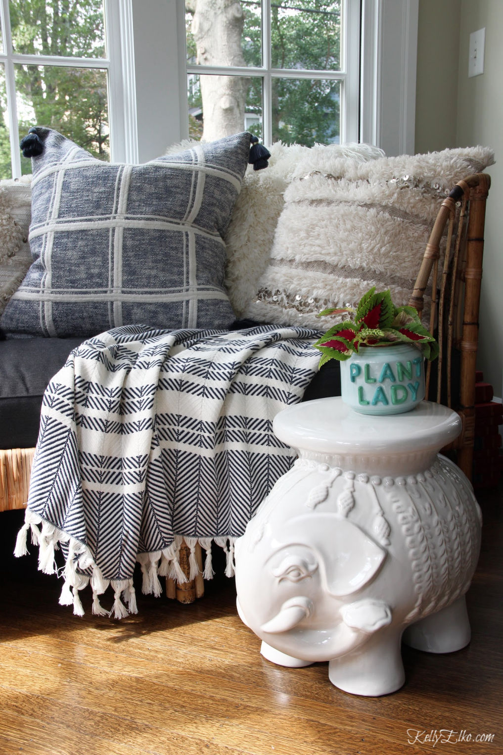 I love rattan daybed with cozy pillows and throws in blue and white and the ceramic elephant stool - see all of my Serena and Lily Sale Picks kellyelkoi.com #bohodecor #boho #serenaandlily #elephant #daybed #rattanfurniture #blueandwhitedecor #homedecor 