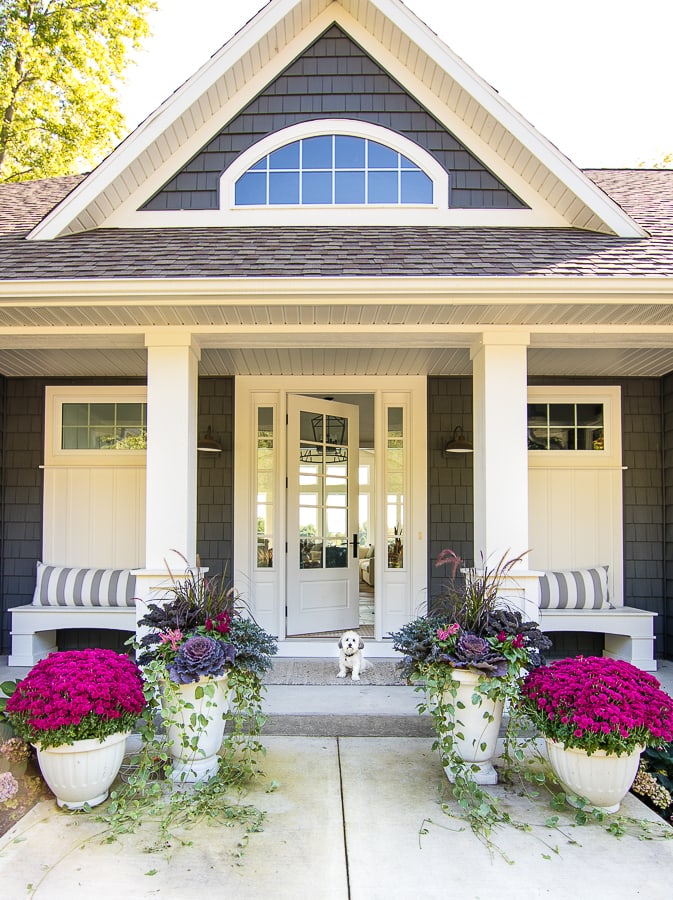 10 Beautiful Fall Porches - love the purple mums and kale planters kellyelko.com #fall #fallporch #falldecor #falldecorating #mums #curbappeal #autummdecor #autummporch