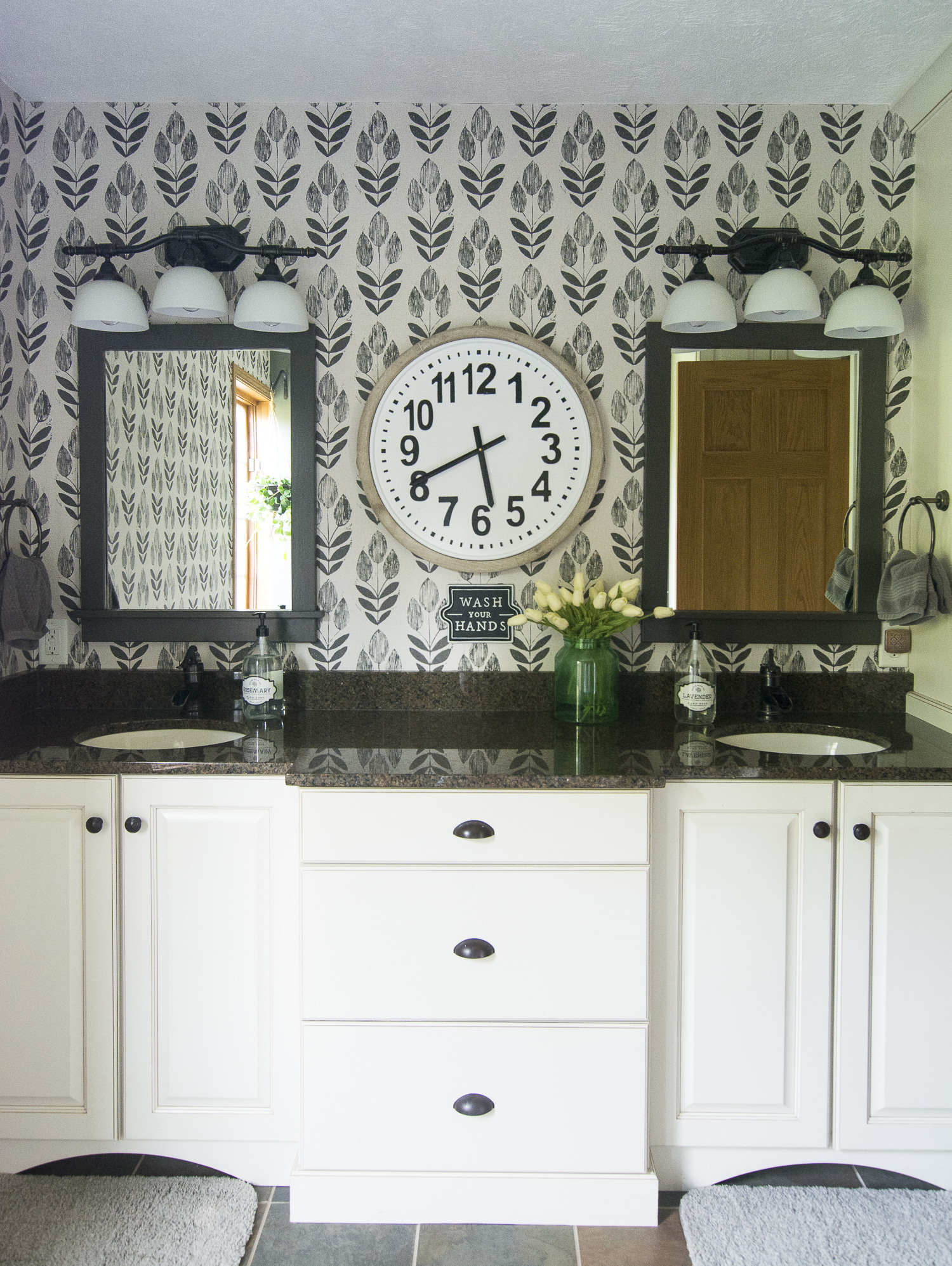 Black and white wallpaper is a statement in this bathroom kellyelko.com #bathroom #wallpaper #bathroomdecor #bathroomreno #interiordesign #blackandwhitedecor 