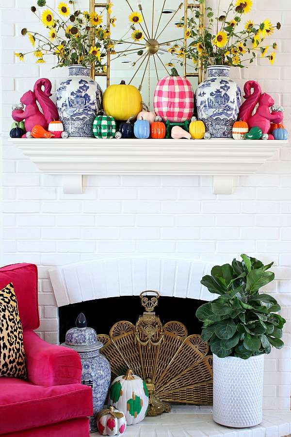 12 Creative Fall Mantels - this colorful fall mantel is so fun with hand painted pumpkins kellyelko.com #fall #falldecor #fallmantel #falldecorating #colorfulfall #colorlovers #mantel #manteldecor #paintedpumpkins #pumpkincrafts 