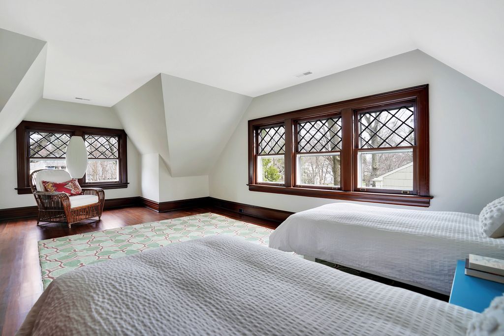 Old home with original diamond paned windows in this huge attic bedroom kellyelko.com #oldhome #oldhouse #architecture #housetour #hometour #bedroomdecor #bedroomdesign 